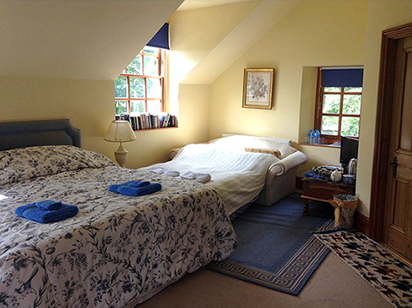 Photo of Master Bedroom with sofa bed ready