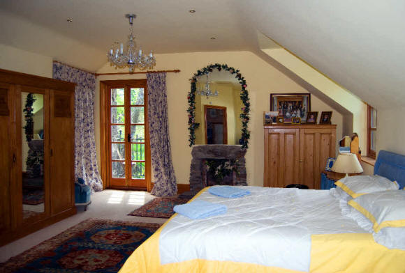 Photo of the Master Bedroom Looking Towards Balcony